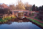 A bridge on The Trent and Mersey Canal with a sign bearing the words 'Welcome to Stone' - Dec 2001.